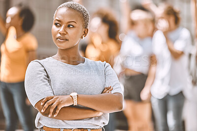 Buy stock photo Protest, crowd and black woman with focus, vision and power for human rights, equality and motivation, idea or thinking in city. Proud african student leader in urban street for group freedom fight