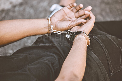 Buy stock photo Arrest, justice and thief in handcuffs for fraud, violence and burglary after a suspected house robbery. Law, hands and gangster criminal going to jail or prison for violence and crime in Venezuela