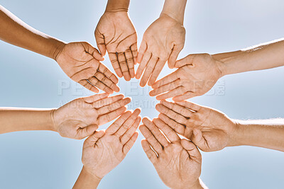 Buy stock photo Hands in circle, teamwork or business people with support, collaboration or team building for mission success from below. Blue sky, diversity or community for vision, partnership or unity goal.