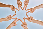 Hands, star and collaboration with a team of people standing in a huddle or circle with their fingers touching. Sky, teamwork and unity with a man and woman group together in support or partnership