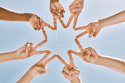 Buy stock photo Hands, star and collaboration with a team of people standing in a huddle or circle with their fingers touching. Sky, teamwork and unity with a man and woman group peace sign in support or partnership