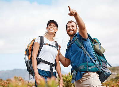 Buy stock photo Hiking, happy and couple in nature, relax and smile, hand and pointing while talking and looking around. Friends, hikers and woman with man in forest, exercise, cardio and adventure outdoor together