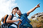 Couple, pointing and bonding on hiking mountains, nature earth environment or countryside hills in Canada. Smile, happy and hiker man and woman backpacking or sightseeing camping land with binoculars