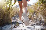 Woman, legs and walking on mountains path in nature earth exploration, sustainability environment or Canada countryside hike. Zoom, hiker and hiking shoes on trekking trail in wellness health fitness