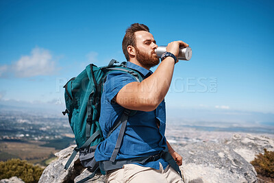 Buy stock photo Hiking, fitness and view with a man drinking water while taking a break from walking in nature for exercise. Mountain, health and summer with a male hiker having a drink from a bottle while exploring