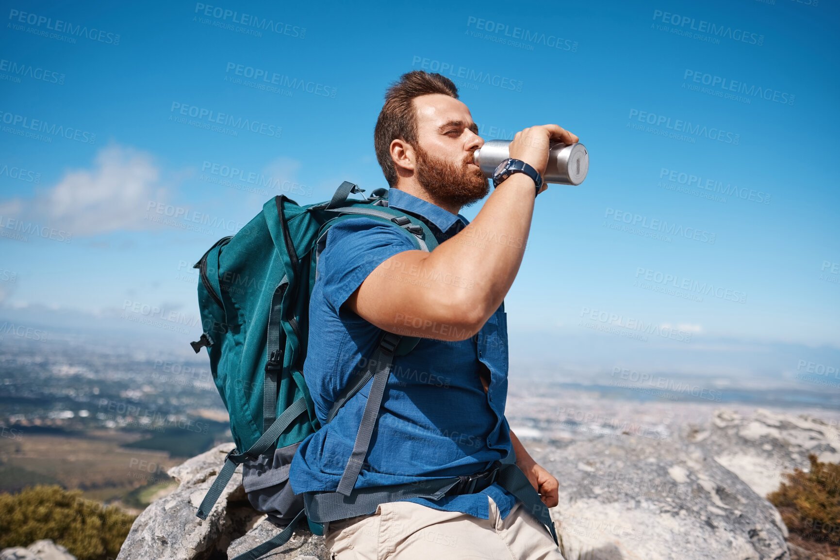 Buy stock photo Hiking, fitness and view with a man drinking water while taking a break from walking in nature for exercise. Mountain, health and summer with a male hiker having a drink from a bottle while exploring