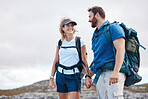 Love, hiking and couple holding hands by the mountains with freedom after traveling, walking or trekking. Nature, Switzerland and happy woman enjoys holiday vacation adventure or journey with partner