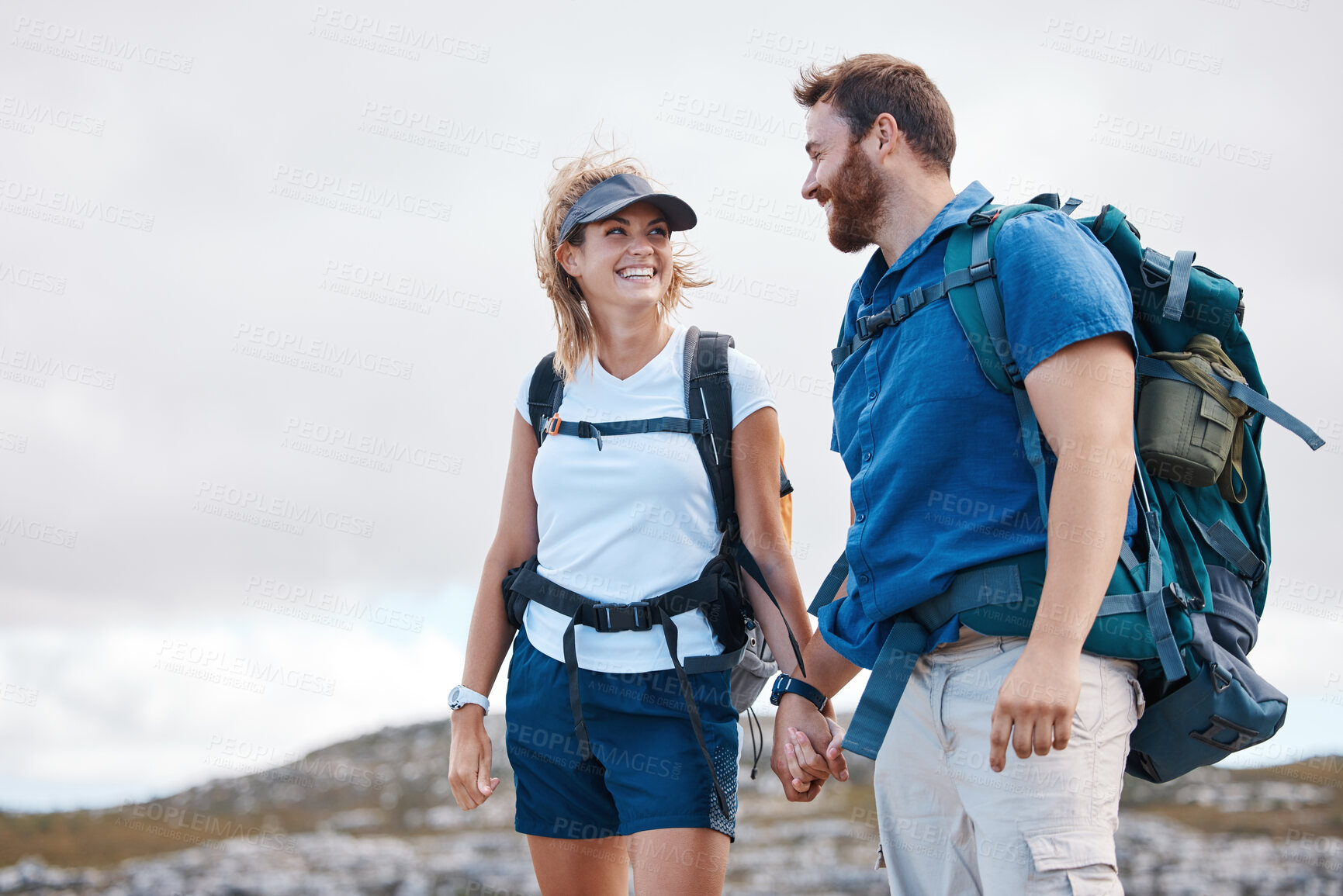 Buy stock photo Love, hiking and couple holding hands by the mountains with freedom after traveling, walking or trekking. Nature, Switzerland and happy woman enjoys holiday vacation adventure or journey with partner