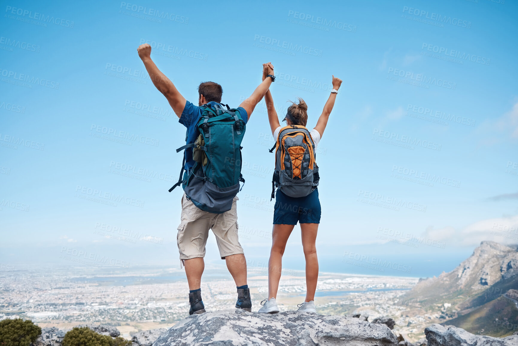 Buy stock photo Success, hiking and couple holding hands on mountain for celebration, motivation and freedom on travel in Costa Rica. Back of happy, excited and trekking man and woman celebrate adventure on a cliff