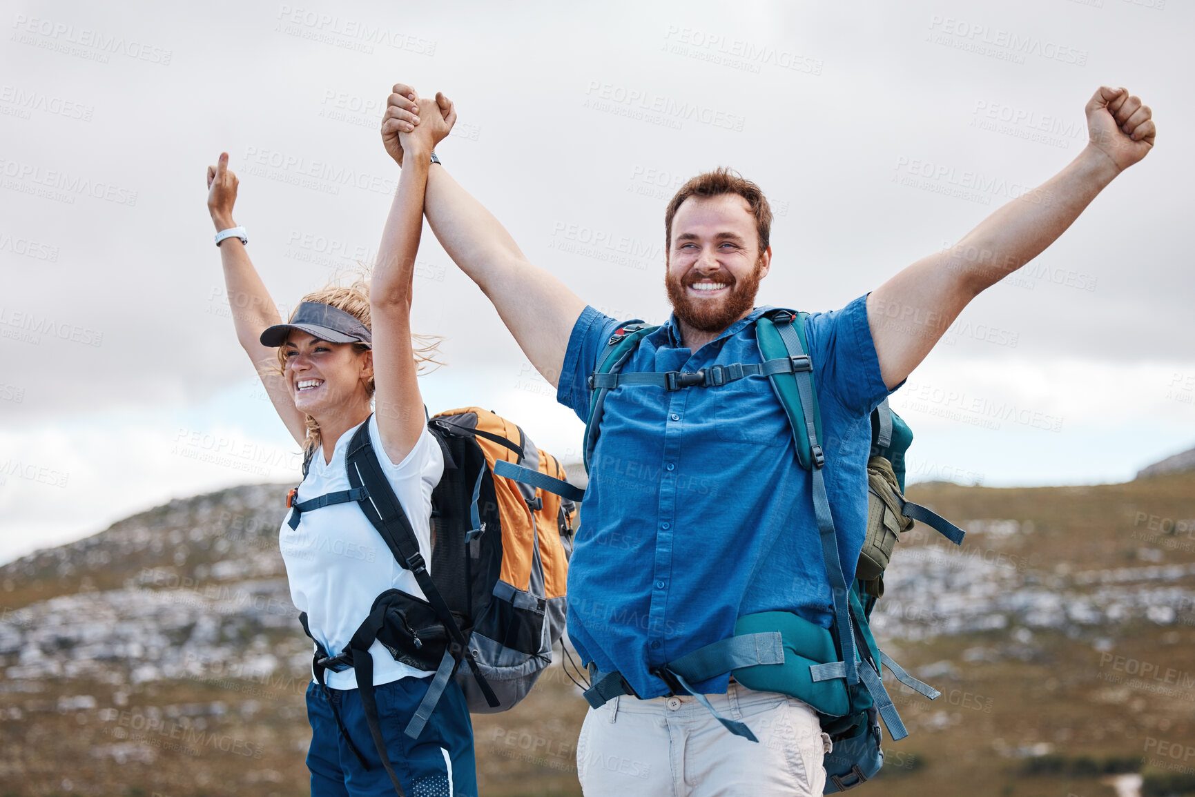 Buy stock photo Hiking, victory and mountain with a winner couple in celebration of success while walking outdoor in nature together. Wow, travel and freedom with a man and woman hiker celebrating at the summit peak