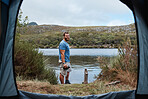 Man, camping and tent by lake, water or river stream in nature earth environment, countryside dam or America sustainability pond. Portrait, smile or happy hiker with flask on weekend adventure break