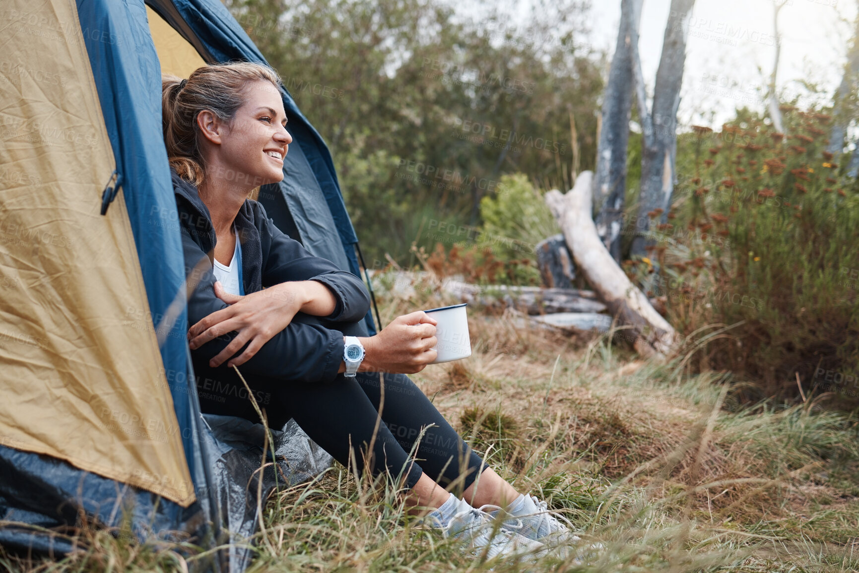 Buy stock photo Camp, woman and coffee in tent, smile and outdoor to enjoy nature, freedom and fresh air. Female, girl and camping drink tea in morning, at campsite and happy with wellness, healthy and natural view.