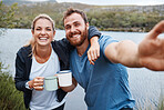 Happy, couple and smile for travel selfie, coffee or journey together in the countryside outdoors. Portrait of man and woman enjoying vacation, traveling or bonding time for capture moments in nature