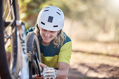 Buy stock photo Cyclist man, fix wheel and nature with mountain bike on adventure, race or ride in forest with smile. Bike, athlete and puncture repair in sunshine while outdoor for fitness, health or sport in woods