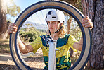 Bike wheel, repair and man checking before doing maintenance on damaged or broken bicycle. Athlete doing inspection on tire before cycling for exercise, fitness or workout in nature, woods or forest.