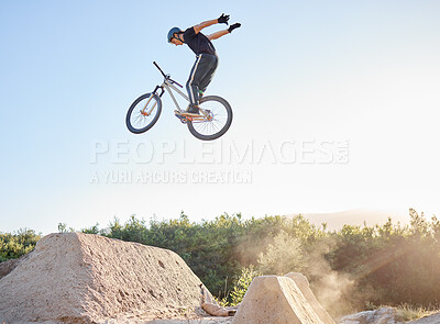 Buy stock photo Bike, man and extreme jump at park, safety gear and outdoor for rush, competition and training for stunt. Bicycle, male athlete or dirt bike practice for fitness, contest or motivation for tournament