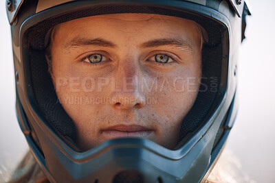Face, helmet and extreme sports with a man biker outdoor alone for adventure or adrenaline. Portrait, safety and motocross with a confident male rider outside alone for fun or recreation closeup