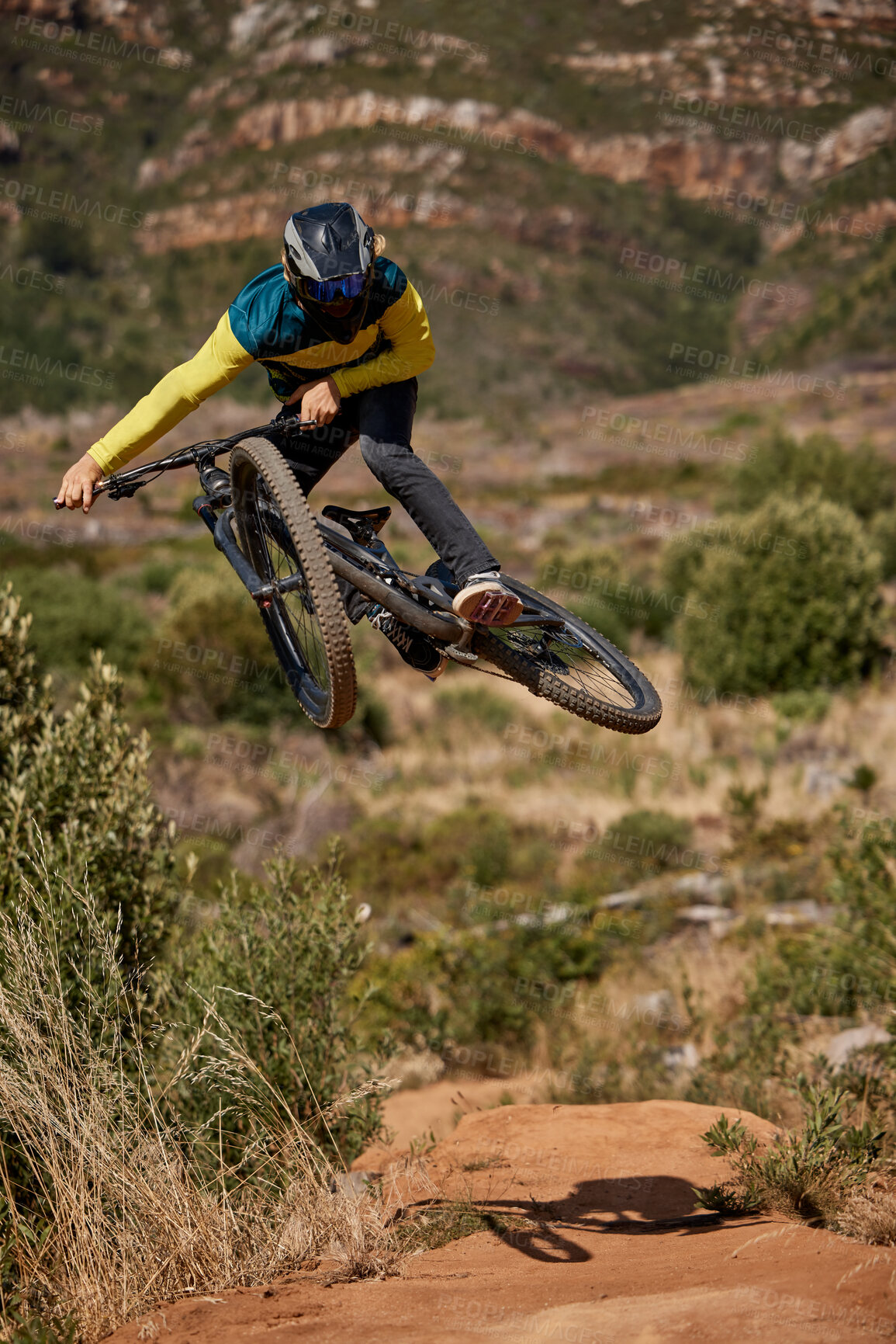Buy stock photo Jump, mountain bike and cyclist performing extreme sport stunt on his bike. Adrenaline, fitness and biking man riding while jumping for competitive racing competition to keep active with cardio 
