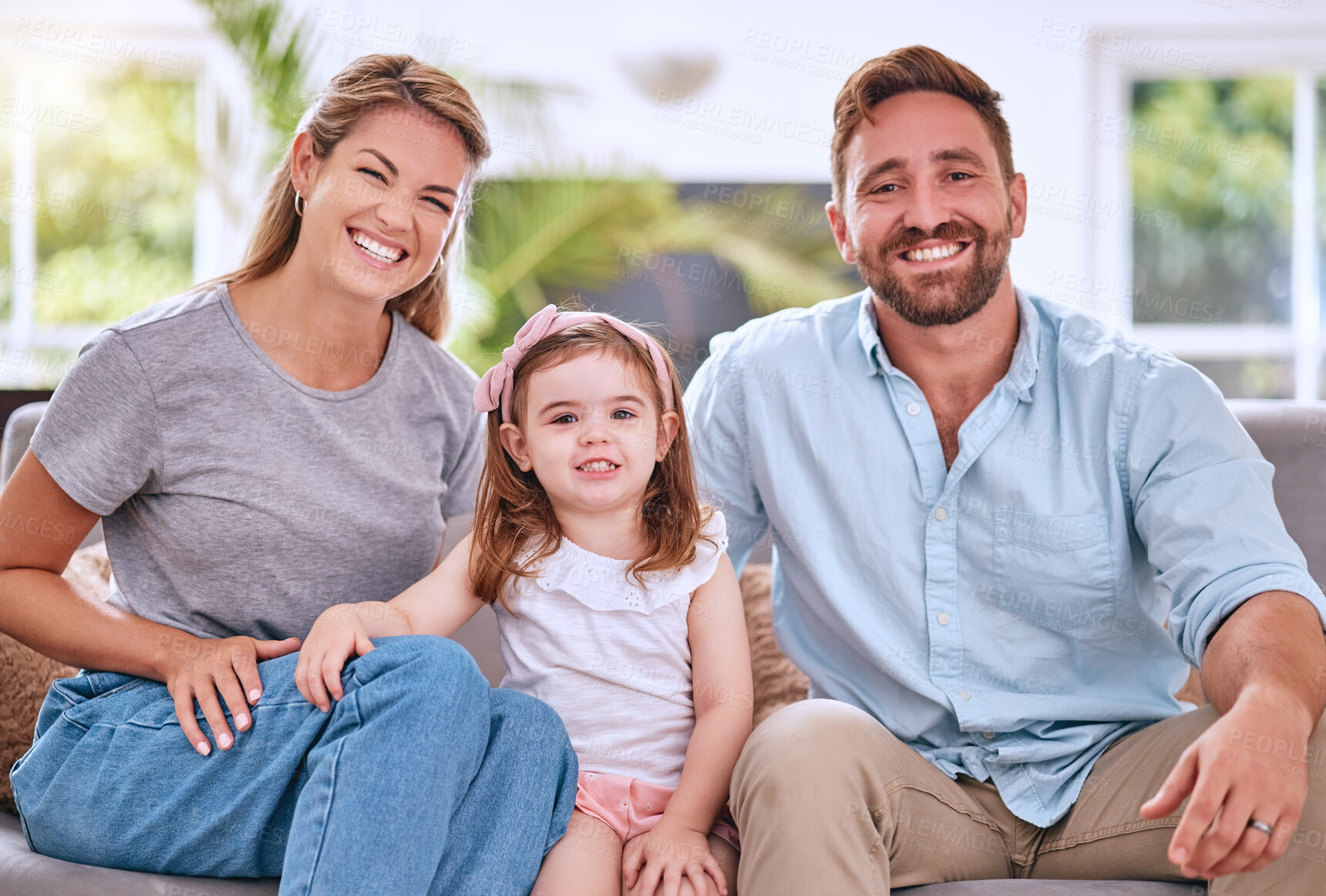 Buy stock photo Happy family portrait, girl kid and parents on living room sofa, couch and relax together for love, care and quality time in Australia. Smile mom, dad and young child in lounge, family home and house