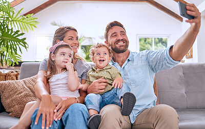 Buy stock photo Selfie, smile and family with phone for relax, love and bonding together on the living room sofa. Happy, content and kids with their mother and father for a photo on a mobile for social media