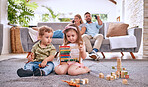 Development, family and children with math toys and playing with building blocks in the house living room. Education, mother and relaxed father watching tv with kids or siblings learning from a game