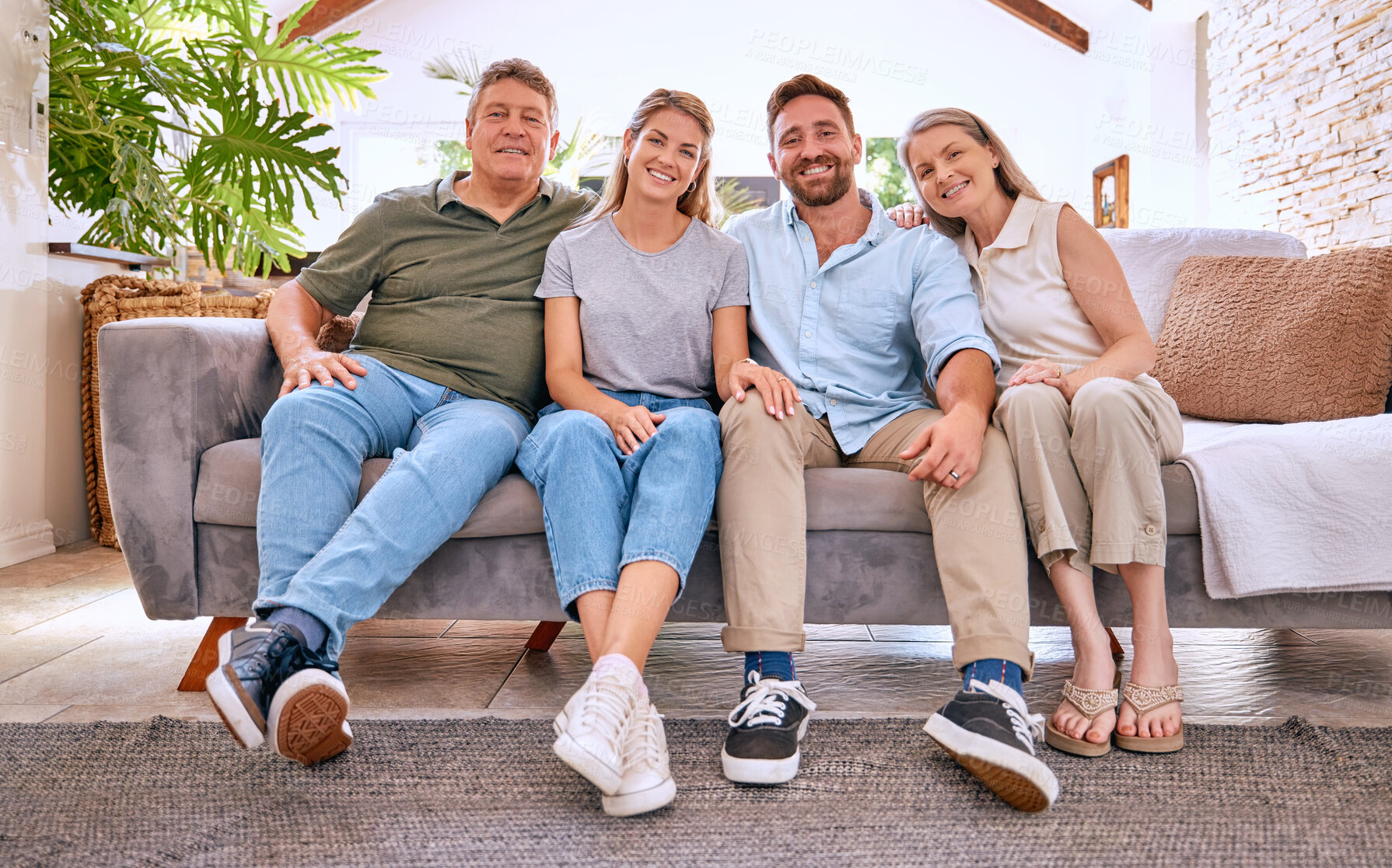 Buy stock photo Big family, portrait and love on sofa in home, bonding and enjoying quality time together. Family care, generations and grandma, grandpa and man and woman on couch in living room relaxing in house.
