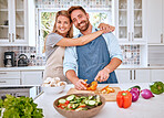 Food, health and cooking couple with vegetables for a healthy organic vegan diet with nutrition and vitamins. Kitchen, love and happy woman enjoys hugging, dinner or lunch preparation with partner