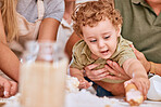 Love, parents and baby with cake mockup for birthday party or celebration together. Adorable child, mother and father celebrate happiness and kids hands playing with food or desert in family home
