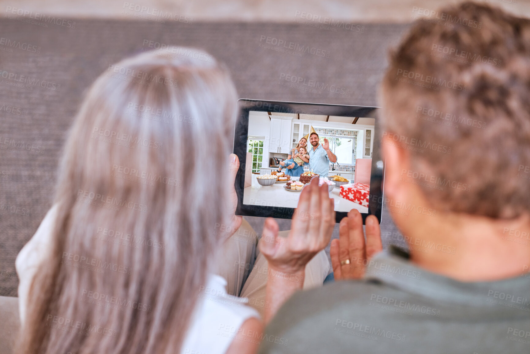 Buy stock photo Senior couple tablet, video call happy birthday to children and communication app on living room sofa. Elderly man, woman and digital mobile technology for internet video conference to congrats kids