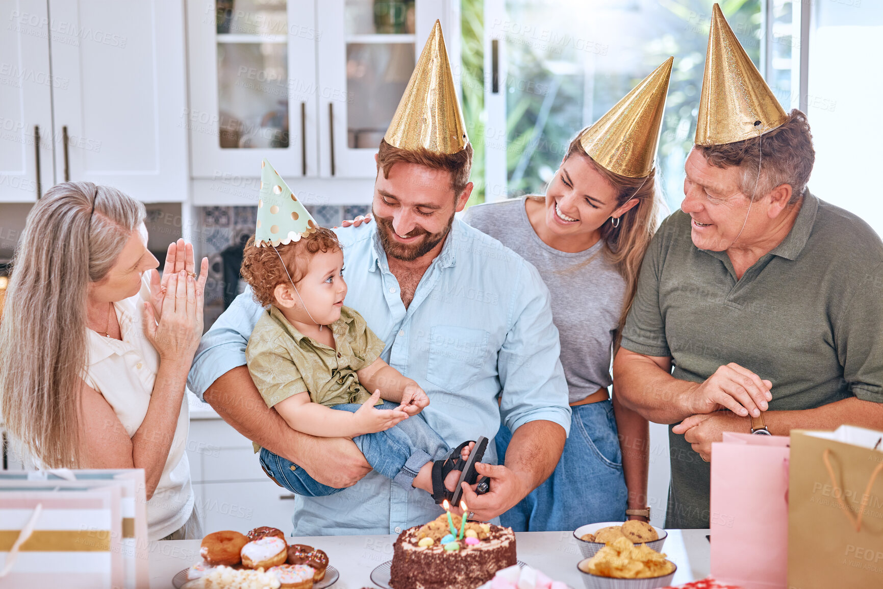 Buy stock photo Happy family, cake and happy birthday for a child at a party with a big family in a lovely celebration at home. Excited grandparents, mother and father celebrate a young kids birthday party together