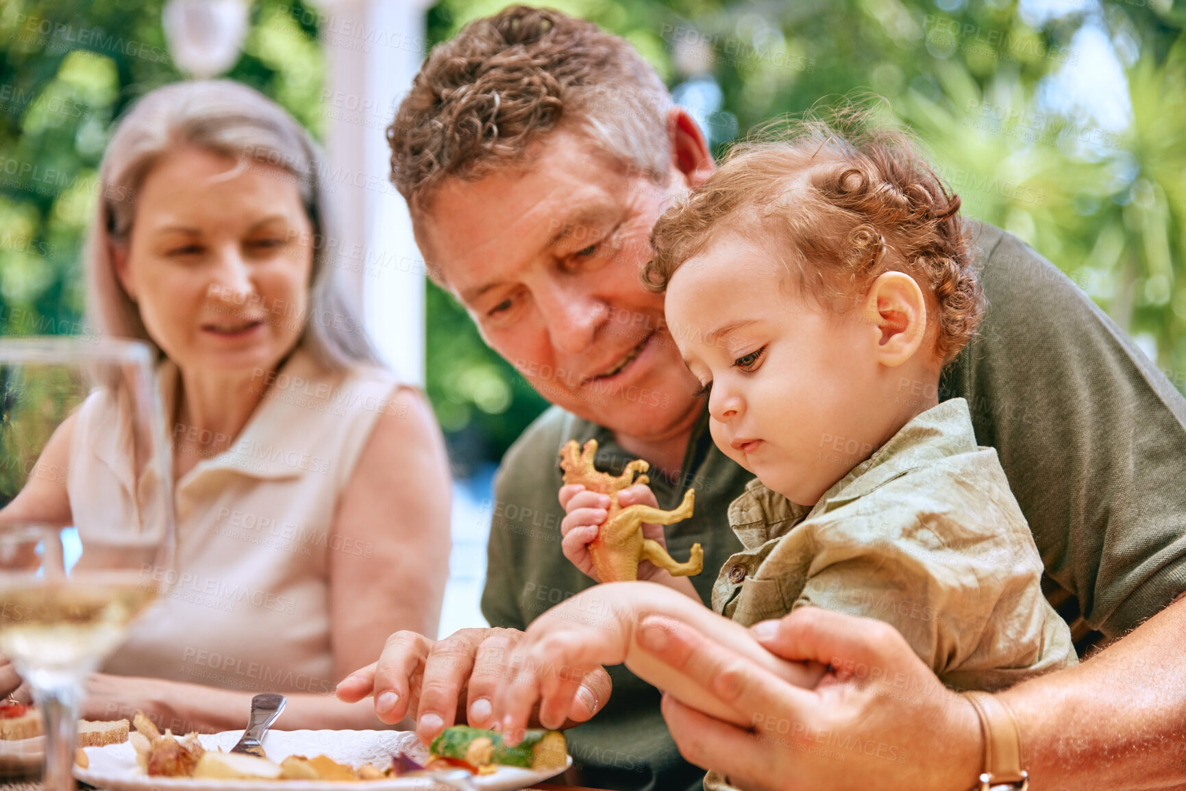 Buy stock photo Food, grandpa and baby on lap eating vegetables for healthy, diet and nutrition in family home. Help, health and elderly grandparents teaching child grip for child development and wellness.

