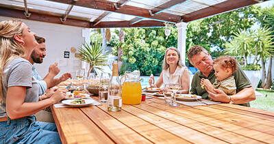 Buy stock photo Family, lunch and outdoor happiness of a mother, man and children with grandparents and kid care. Happy big family, kids and parents together bonding with barbecue food in summer eating with a smile