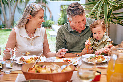 Buy stock photo Family, dinner and eating food at restaurant together smile and happy grandparents bonding with child. Elderly couple, healthy leisure lifestyle and wellness teaching or feeding kid vegetable stew.