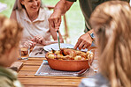 Turkey lunch, family and man cut food for celebration event, happy family reunion and enjoy quality time together on home patio. Love, happiness and group of people eating chicken meal at brunch