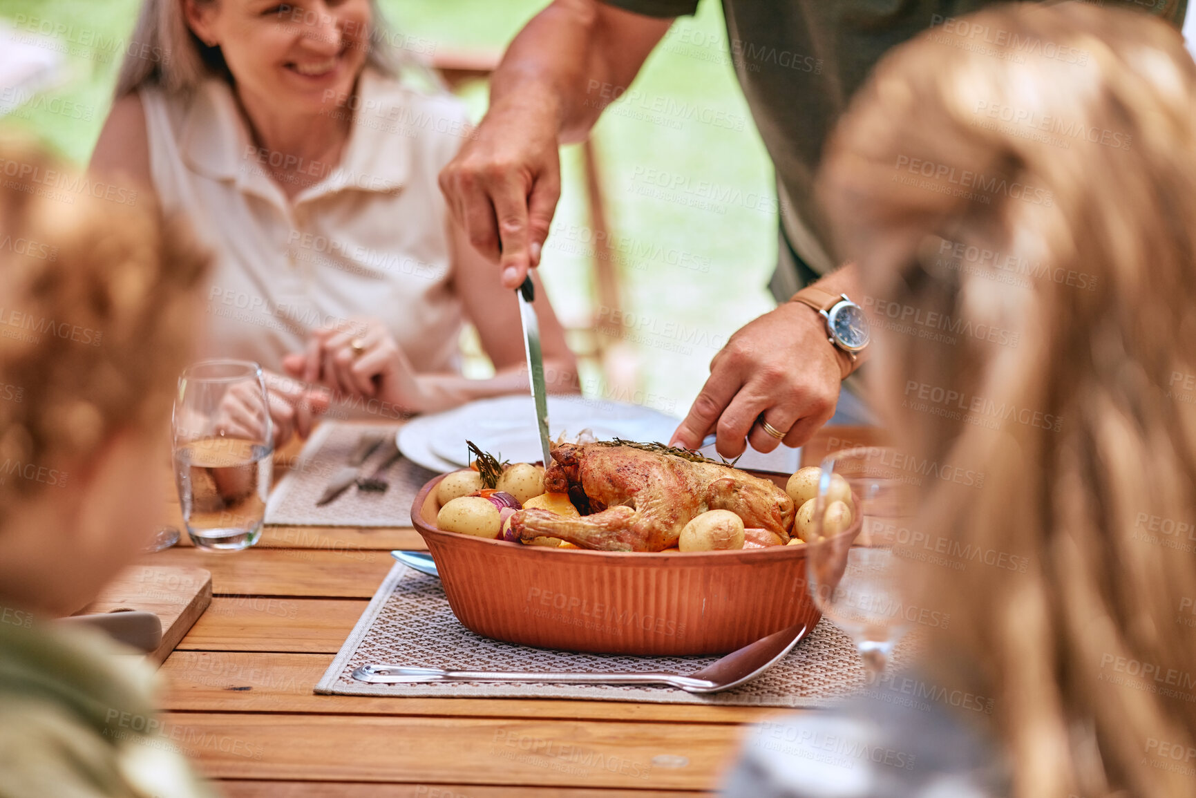 Buy stock photo Turkey lunch, family and man cut food for celebration event, happy family reunion and enjoy quality time together on home patio. Love, happiness and group of people eating chicken meal at brunch