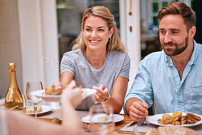 Buy stock photo Family, food and eating together, couple have meal at family home for celebration or weekend lunch. Relax, happy and smile while bonding, party or holiday dinner with happiness and nutrition.