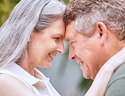 Buy stock photo Love hug, forehead and senior couple bond, smile or happy on anniversary vacation for peace, trust or partnership. Romantic eye contact, marriage and elderly man and woman enjoy quality time together