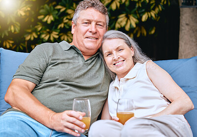 Buy stock photo Family, portrait and senior couple with juice on patio, happy and smile while bonding, talking and relax. Love, retirement and elderly man with woman in a garden, hug, relaxing and retired lifestyle