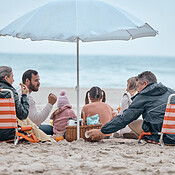 Family, beach food and relax on holiday, vacation or trip outdoors