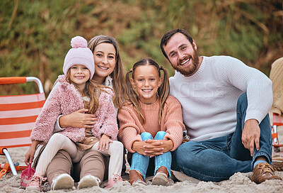 Buy stock photo Beach, winter and portrait of kids with parents sit on sand on holiday picnic. Mom, dad and children relax at ocean in Australia. Freedom, fun and vacation, happy man and woman with girl kids at sea.