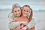Hug, beach and portrait of girl and grandma on vacation, holiday or trip. Family love, care and happy grandmother bonding with kid, having fun and enjoying quality time together outdoors on seashore.