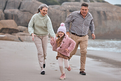Buy stock photo Beach, running and family grandparents with child holding hands for outdoor wellness, energy and development holiday. Happy, excited girl or kid with her grandmother and father run together by sea