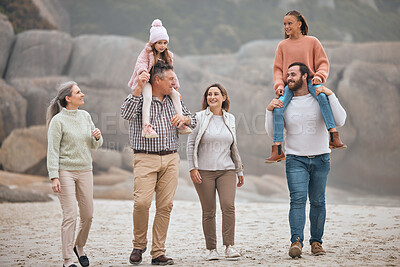 Buy stock photo Family, children and beach with grandparents, parents and grandkids walking on the sand at the coast together. Summer, travel and love with a man, woman and kids bonding on a coastal walk outdoor