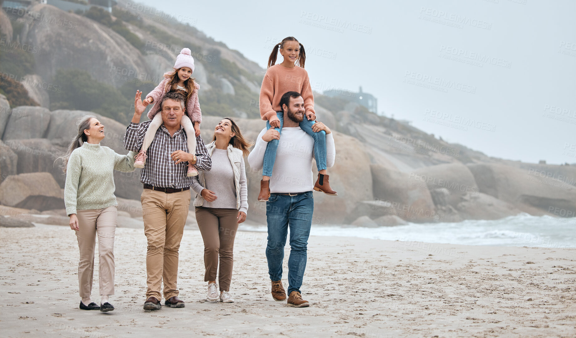 Buy stock photo Big family walking on beach with children and grandparents for outdoor wellness, holiday fun and support by the sea with sky mock up, Healthy mom, dad and kids bonding by ocean together and talking