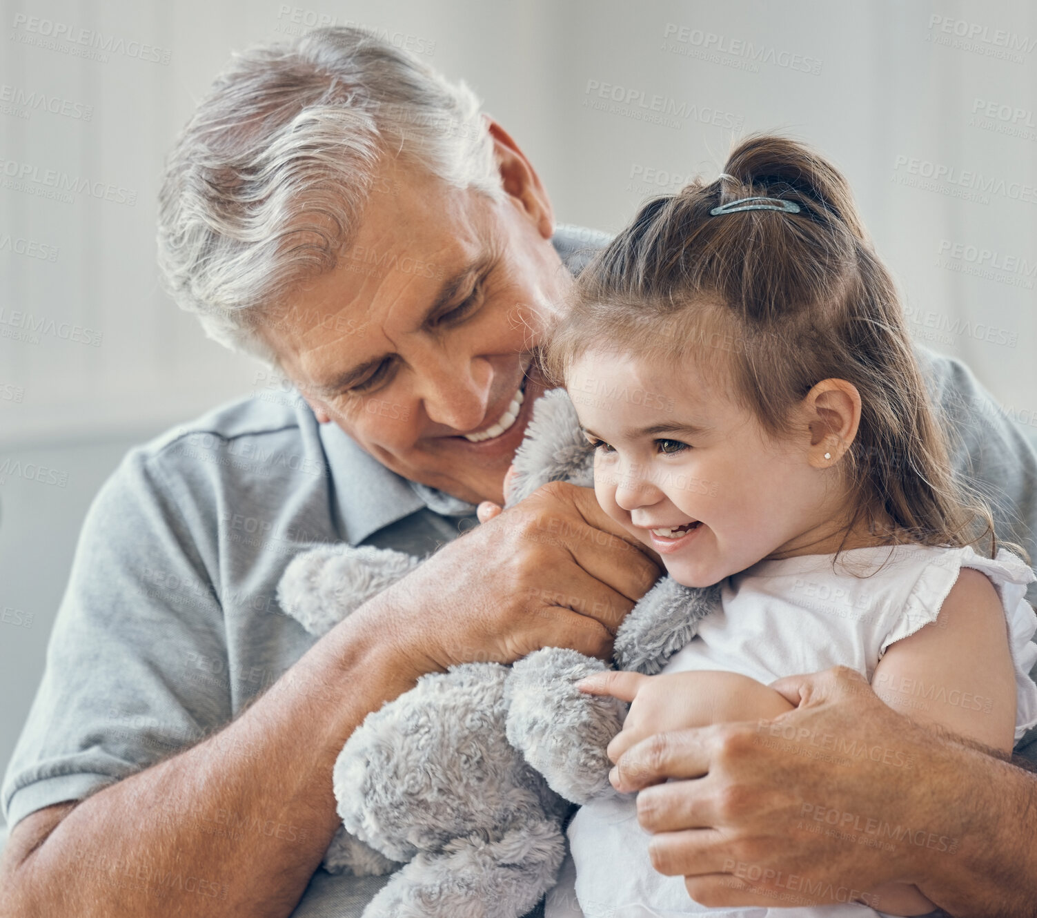 Buy stock photo Grandfather play with grandchild girl in living room, lounge and family home with teddy bear toys, fun and happiness in Australia. Happy senior grandparent man relax with young kids together in house