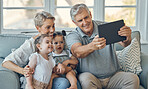 Family, grandparents and children take tablet selfie of happy family bonding, togetherness and enjoy quality time. Love, memory photo and happiness of kids, grandmother and grandfather relax on sofa