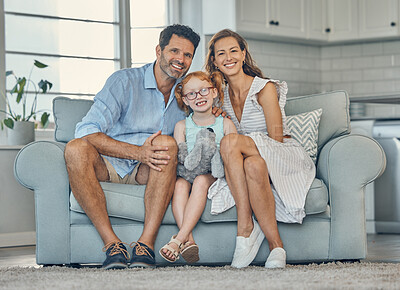 Buy stock photo Smile, portrait and happy family love to relax together in a positive home on a fun weekend for bonding. Happiness, mother and father smiling with young girl or child enjoying quality time and love