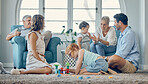 Big family, bonding and children playing in living room, relax and cheerful in their home together. Happy grandparents, parents smile and enjoy fun, watching kids play on floor while resting on couch