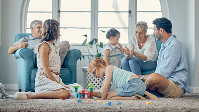 Buy stock photo Big family, bonding and children playing in living room, relax and cheerful in their home together. Happy grandparents, parents smile and enjoy fun, watching kids play on floor while resting on couch