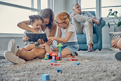 Buy stock photo Mother, children and digital tablet in living room with family relax, play and bond in their home together. Learning, kids and mom watching online game, cartoon and entertainment with girl on carpet